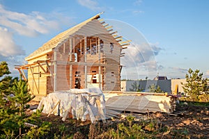 Construction of a house made of laminated veneer lumber. The frame of the house. Cottage made of laminated wood. Erection of the