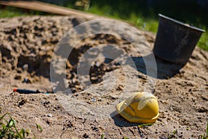Construction of a house, sand and children`s toys