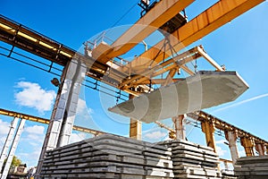 Construction industrial worker operating hoisting process of concrete slab photo