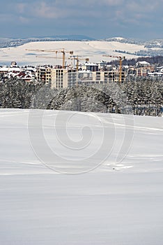 Construction industry apartment and housing development at Zlatibor in winter season under snow