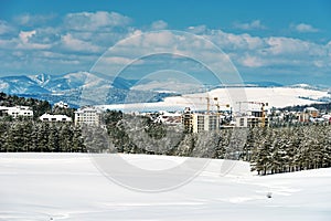 Construction industry apartment and housing development at Zlatibor in winter season under snow