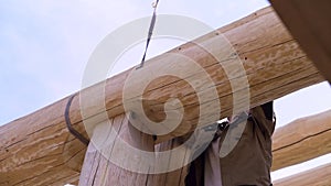 Construction industry concept, bottom view of a carpenter trying to unhook the cable construction. Clip. The process of