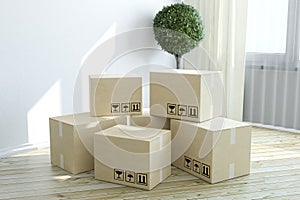 Construction industry, housing, habitation and real estate business concept: group of stacked cardboard boxes on wooden laminated