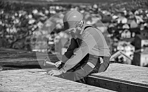 Construction Industry and Waterproofing. roofer working on roof structure of building on construction site. roofer wear