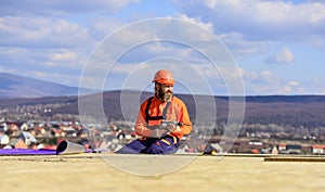 Construction Industry and Waterproofing. roofer working on structure of building on construction site. roofer wear