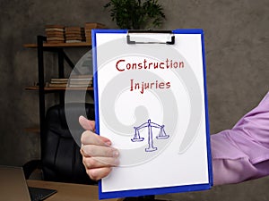 Construction Injuries inscription on the piece of paper