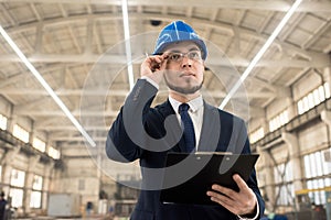 Construction inspector examining building structure