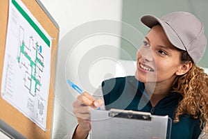 construction inspector woman holding clipboard