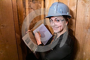 Construction inspector woman takes notes