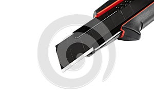 Construction knife isolated on white background. Cutter knife construction black and red colour isolated on white background.