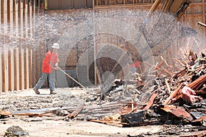 Construction laborer sweeping photo