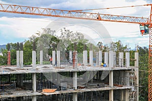 Construction laborer team working and crane on high ground building housing in site workplace