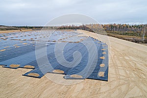 The construction of the landfill and installation of geomembrane