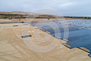 The construction of the landfill and installation of geomembrane