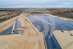 The construction of the landfill and installation of geomembrane