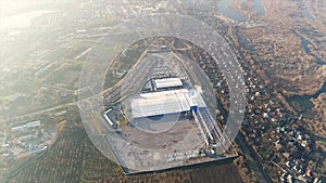 Construction of a large factory, Industrial exterior, panoramic view from the air. Construction site, metal structure