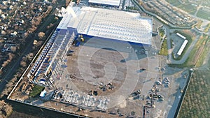 Construction of a large factory, Industrial exterior, panoramic view from the air. Construction site, metal structure