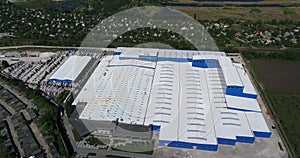 Construction of a large factory, Industrial exterior, panoramic view from the air. Construction site, metal structure