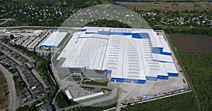 Construction of a large factory, Industrial exterior, panoramic view from the air. Construction site, metal structure