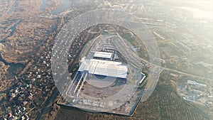 Construction of a large plant or factory, industrial exterior, panoramic view from the air, construction site, metal