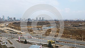 Construction of a large residential area. The construction site is visible. Multi-storey buildings and infrastructure under constr