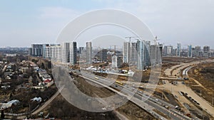 Construction of a large residential area. The construction site is visible. Multi-storey buildings and infrastructure under constr