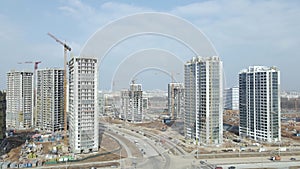 Construction of a large residential area. The construction site is visible. Multi-storey buildings and infrastructure under constr