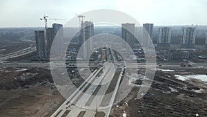 Construction of a large residential area. The construction site is visible. Multi-storey buildings and infrastructure under constr