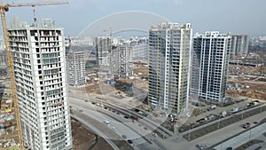 Construction of a large residential area. The construction site is visible. Multi-storey buildings and infrastructure under constr