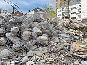 Construction machinery at the construction site is engaged in the dismantling of buildings. A demolished