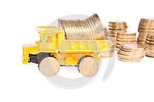 Construction machinery over a lot of golden coins