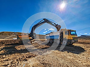 Construction machinery in the process of loading and transporting materials