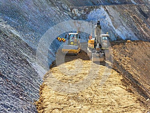 Construction machinery in the process of loading and transporting materials