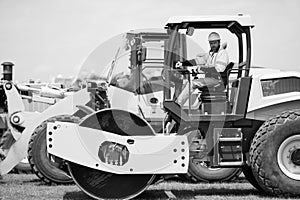 construction machinery worker outdoor. machinery in manufacturing industry with construction worker. construction worker