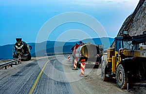 Construction machines on a mountain road