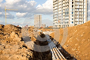 Construction of main water supply pipeline. Laying underground storm sewers at construction site