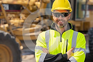 Construction man with helmet. Worker at construction new building. Builder at construction site. Foreman workman