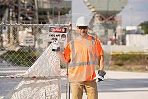 Construction man with helmet. Worker at construction new building. Builder at construction site. Foreman workman