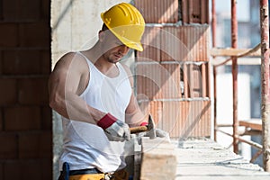 Construction Man Hitting Wood With Hammer