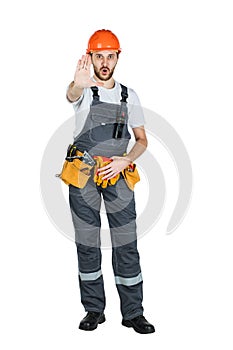 A construction man shows a stop sign. isolated on white background