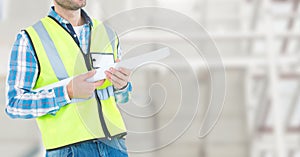 Construction man standing with blue print