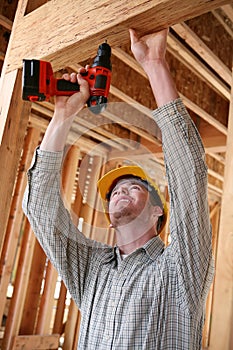 Construction Man Using Drill