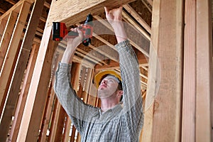 Construction Man Using Drill photo