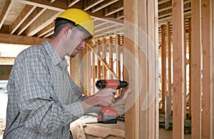 Construction Man Using Drill