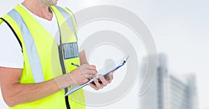 Construction man writing on clipboard against white background