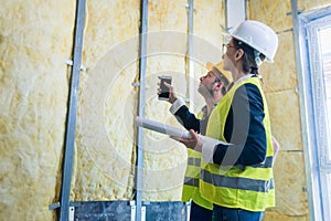 Construction manager and architect checking the insulation works