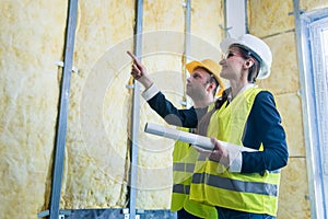 Construction manager and architect checking the insulation works