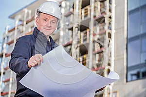 Construction manager with blueprints