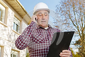 Construction manager giving information on estimate cost