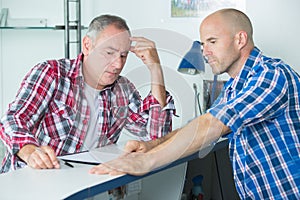 Construction manager resolving problem with colleague